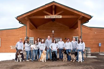 Doggie Dude Ranch and O'Cat Corral staff photo in front of registration lodge